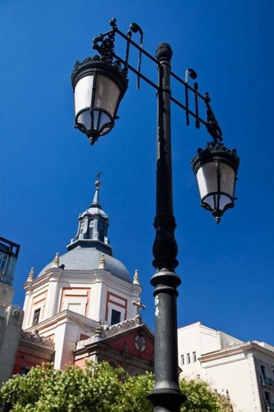 Spain Madrid Lamppost and the dome of the Las Calatravas Church Canvas Art - Julie Eggers DanitaDelimont (18 x 24)