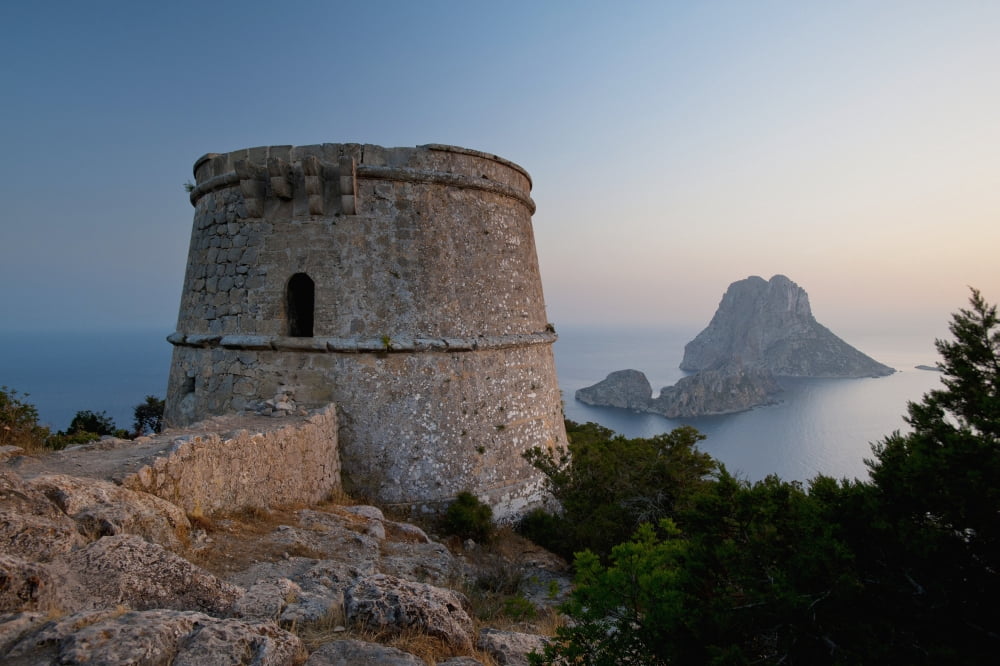 Spain Torre des Savinar and Es Vedra island at sunset Ibiza Canvas Art - Ian Cumming Design Pics (19 x 12)