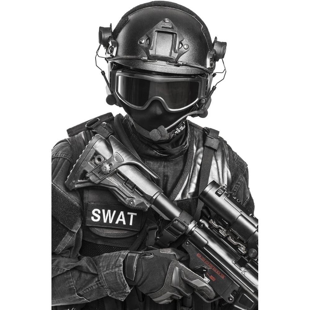 Spec ops police officer SWAT in black uniform and face mask studio shot ...