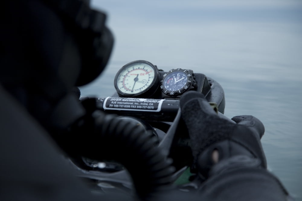 Special operations forces combat diver checks the depth gauge on his compass Canvas Art - Tom WeberStocktrek Images (35 x 24)