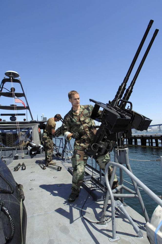 Special warfare combatant craft crewmen mounting 50 caliber machine guns during maneuvers in Coronado Bay Canvas Art - Stocktrek Images (23 x 34)