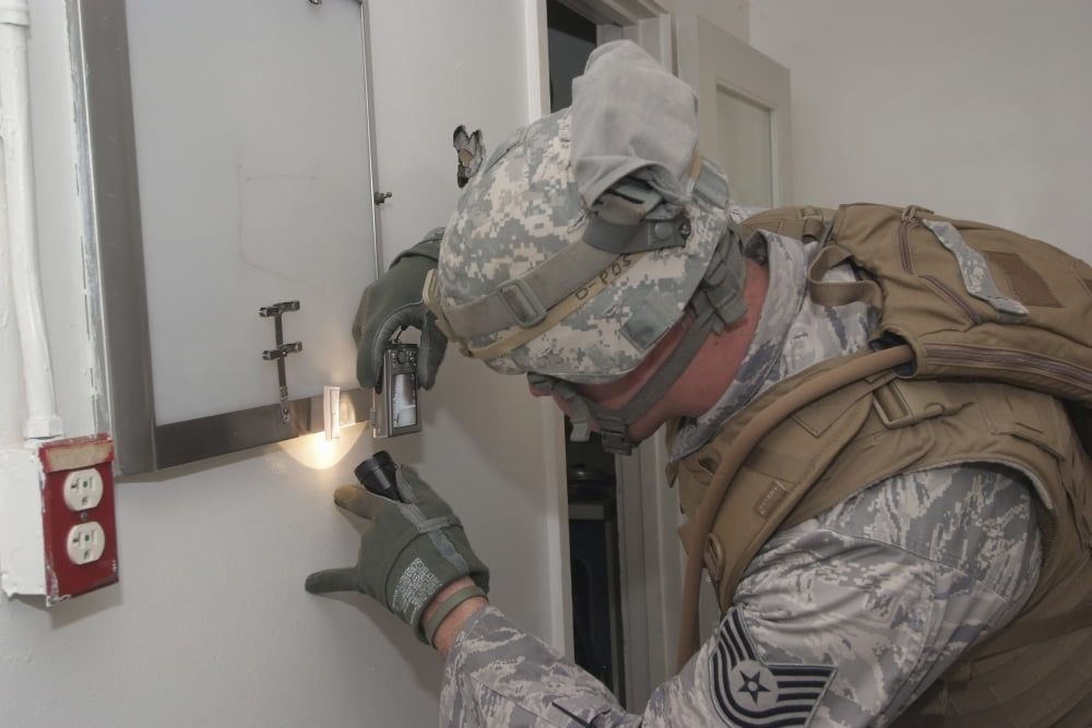 Specialist takes a photograph of evidence during a battlefield forensics course Canvas Art - Stocktrek Images (35 x 23)
