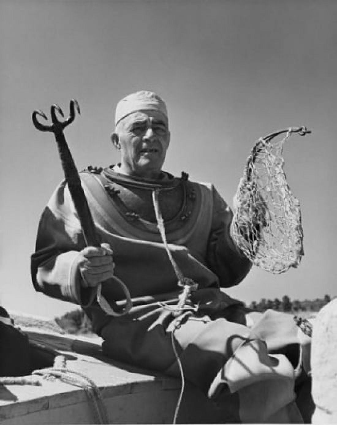 Sponge diver holding hook and fishing net Canvas Art - (24 x 36)