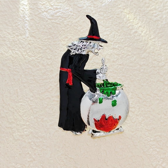 Spooky witch stirring cauldron brooch