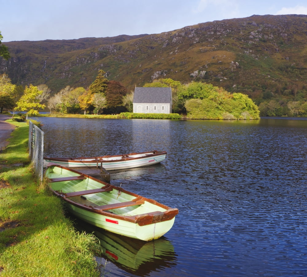 St Finbarres Oratory And Rowing Boats On Shore Of Gougane Barra Lake In Gougane Barra Forest Park County Cork Republic Of Ireland Canvas Art - Ken Welsh Design Pics (32 x 28)