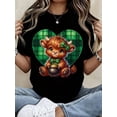 thumbnail image 1 of St. Patrick's Day Cute Cow T-Shirt With Green Plaid Heart And Pot Of Gold Design For Women, Irish Festival Shirt, Lucky Animal Graphic Tee, Unisex White Cotton Top, 1 of 6