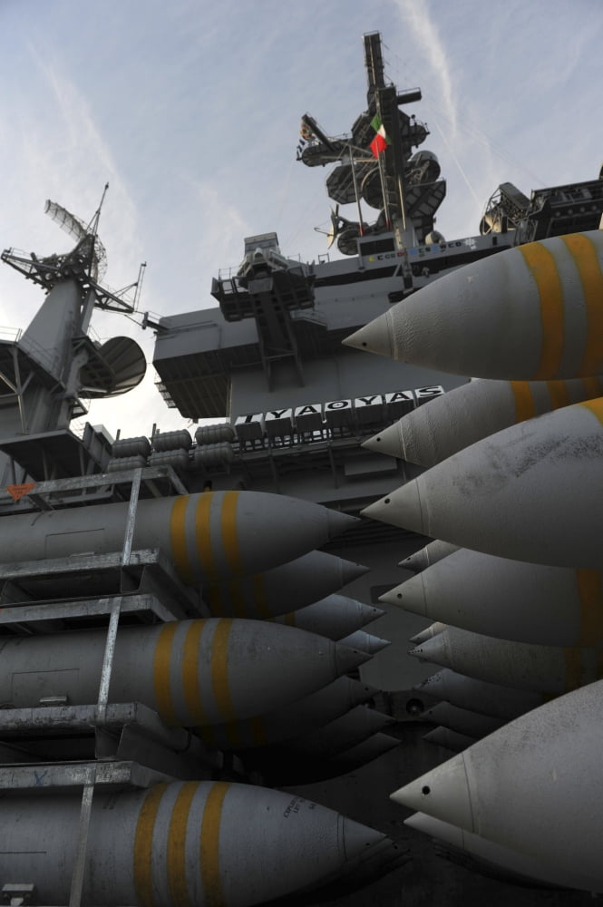 Stacked ordnance ready to be loaded aboard USS John C Stennis Canvas Art - Stocktrek Images (23 x 34)