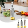 thumbnail image 1 of Stainless Steel Oil Bottle with Measurement Scale | Press Type Dispenser for Olive Oil Vinegar Seasoning | Automatic Spout | Durable Glass Core | 200ml 300ml 500ml | 1 Piece, 1 of 6