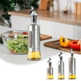 thumbnail image 1 of Stainless Steel Oil Dispenser Bottle with Scale | Transparent Window | Automatic Open-Close Nozzle | Glass Inner Liner | 200ml 300ml 500ml | Leakproof Kitchen Cooking Container, 1 of 9