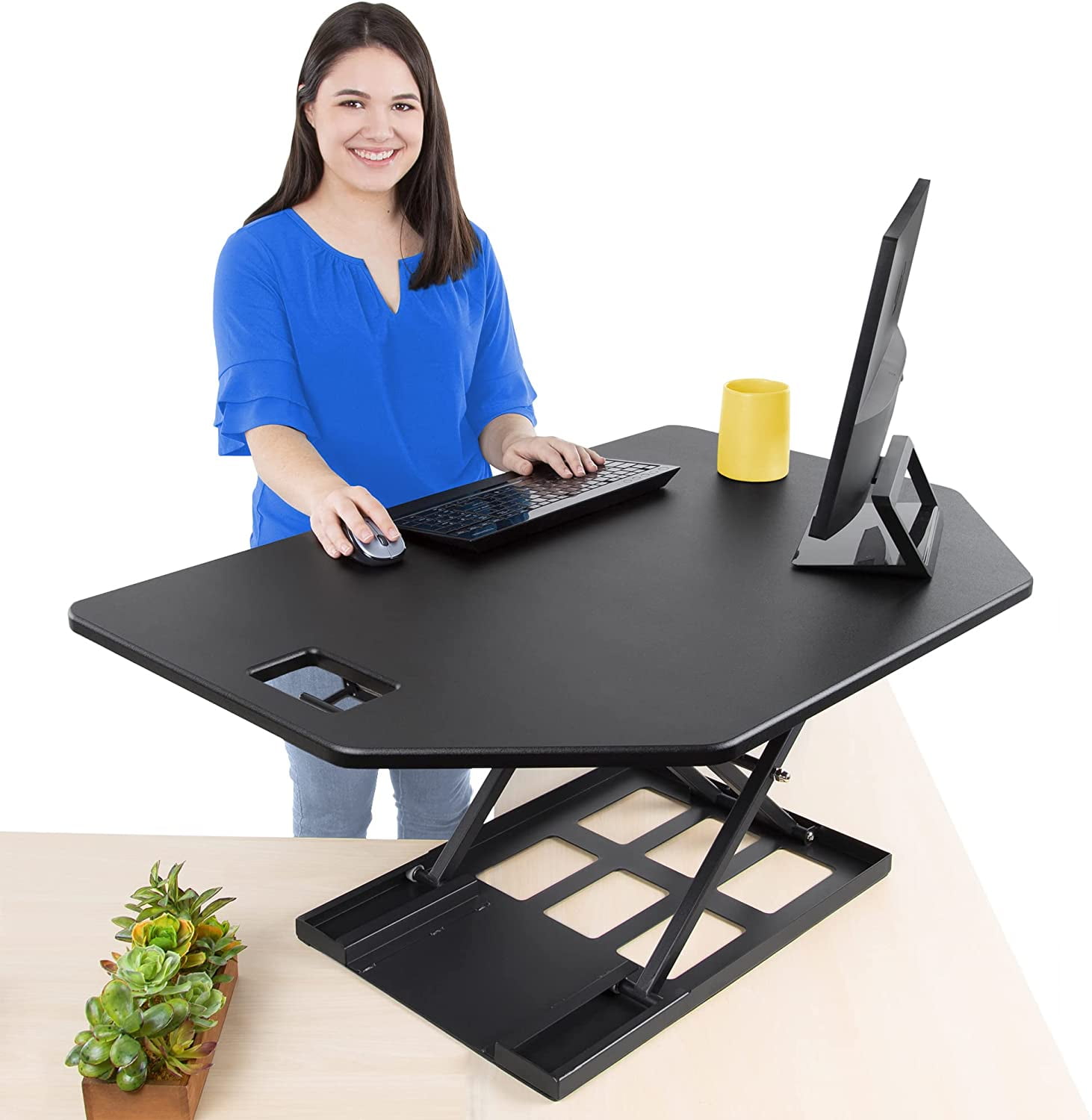 Height adjustable desk converter outlet
