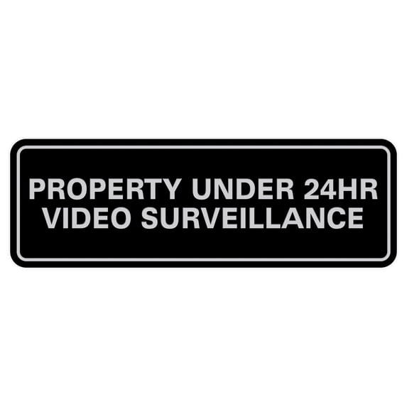 Standard Property Under 24 Video Surveillance Sign - Black / Silver - Small 2" X 6"