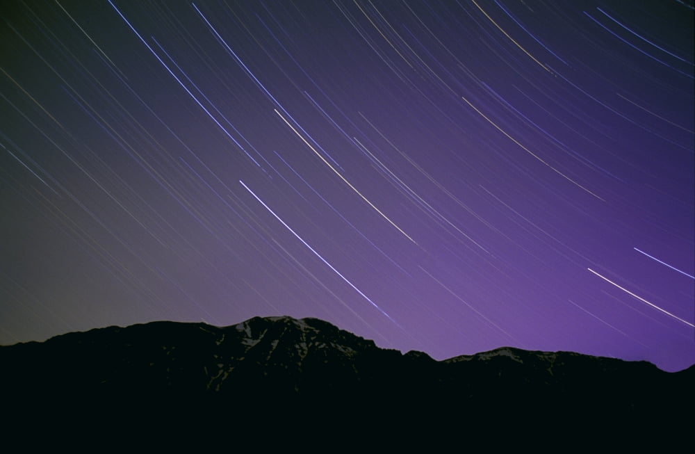 Star Trails In Nights Sky Canvas Art - Carson Ganci Design Pics (17 x 11)