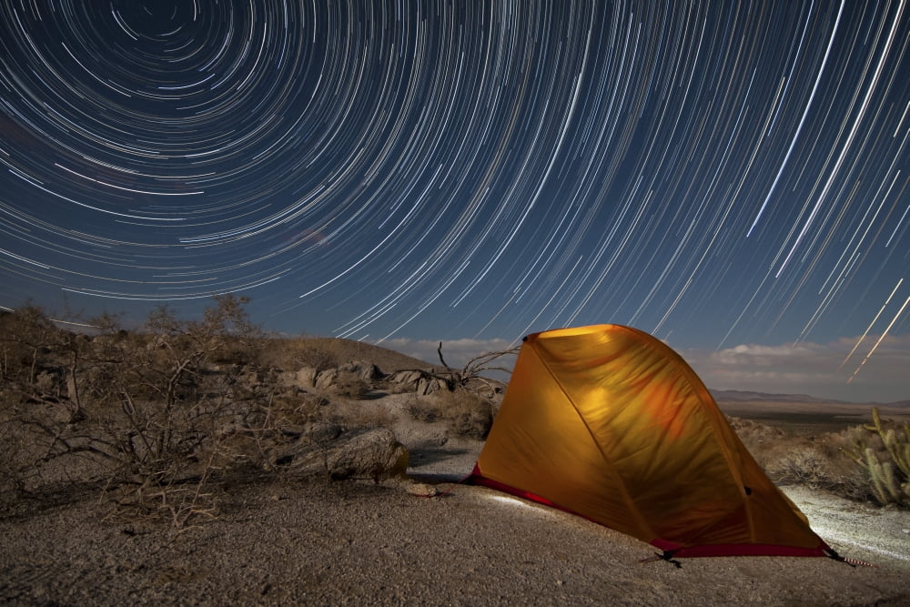 Star trails above a campsite in Anza Borrego Desert State Park California Canvas Art - Dan BarrStocktrek Images (35 x 23)