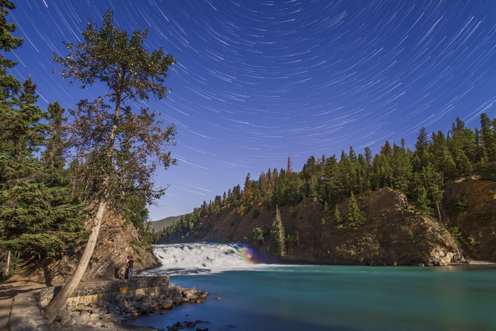 Star trails and moonbow over Bow Falls on the Bow River in Banff Alberta Canada Canvas Art - Alan DyerStocktrek Images (34 x 23)