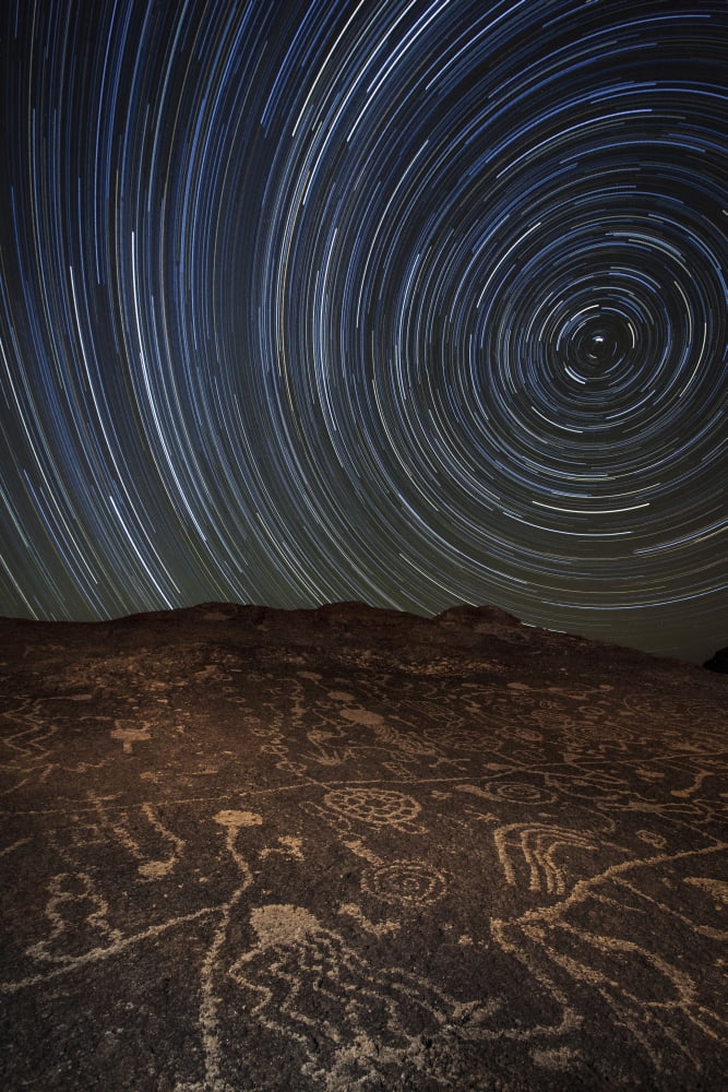 Star trails at an ancient petroglyph site near Bishop California Canvas Art - Dan BarrStocktrek Images (12 x 18)
