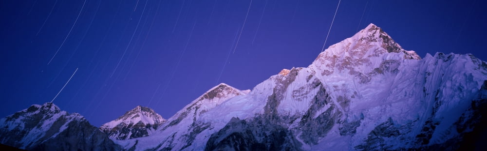 Star trails over snowcapped Nuptse and Mt Everest range Everest Base Camp Trek Khumbu Nepal Canvas Art - Panoramic Images (12 x 36)