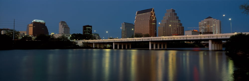 This is the State Capitol and skyline at sunset The city is on the Colorado River It is called the live music capitol Canvas Art - Panoramic Images (27 x 9)