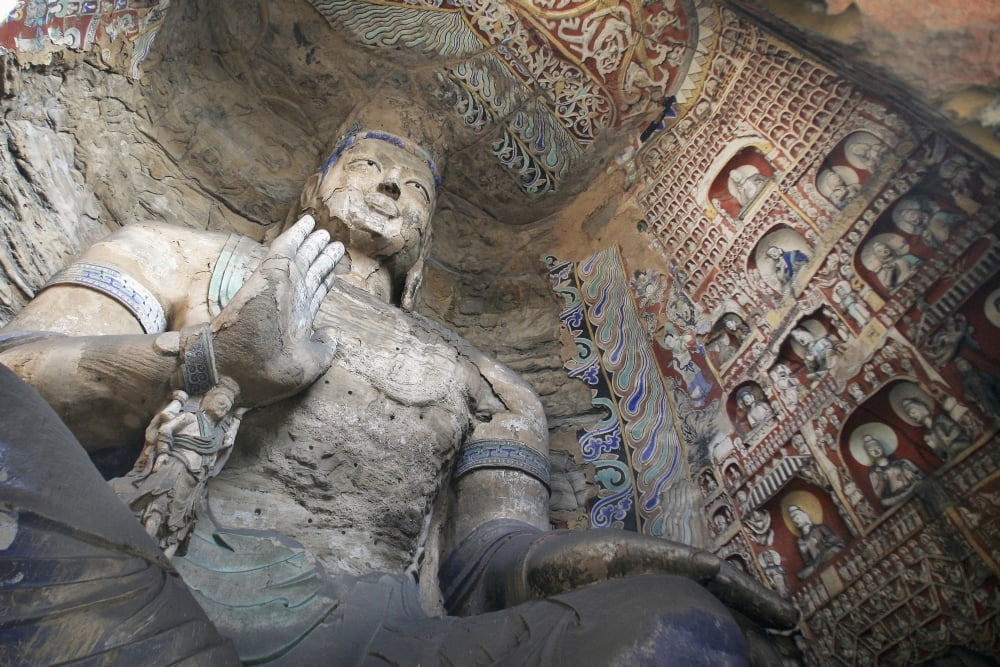 Statue And Carvings In Ancient Buddhist Temple Grotto Canvas Art - Timothy Allen Design Pics (34 x 22)
