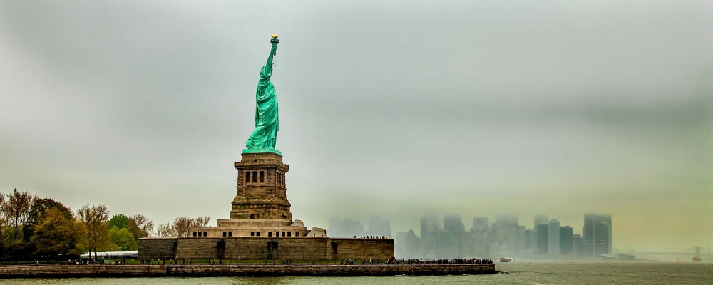 Statue of Liberty with cityscape in the background Liberty Island New York City New York State USA Canvas Art - Panoramic Images (12 x 30)