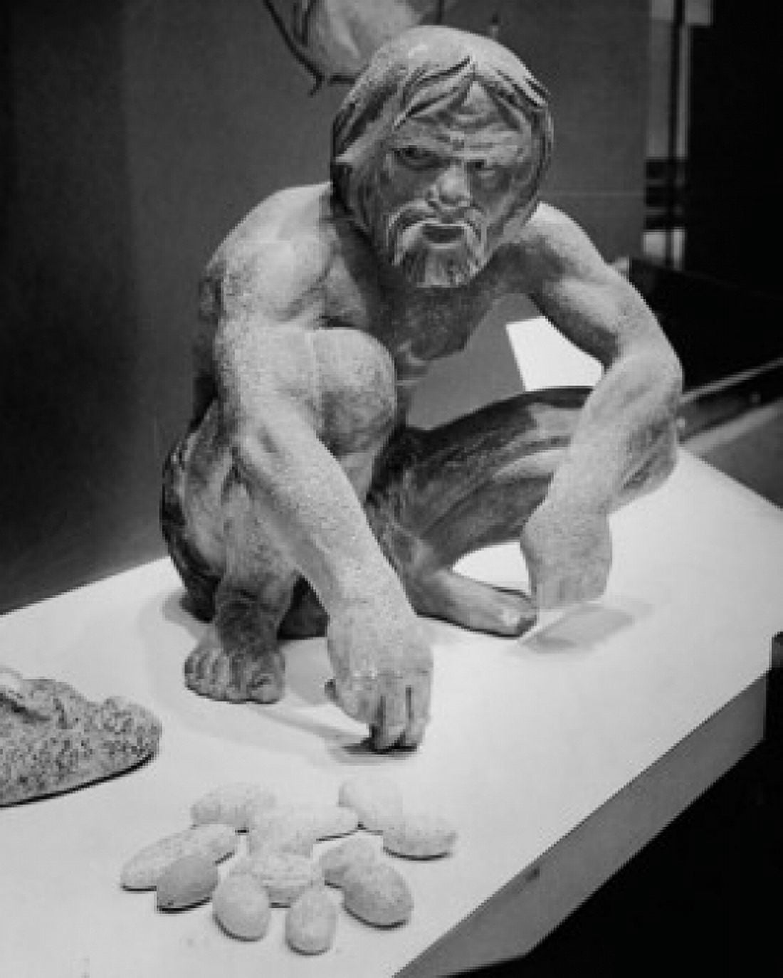 Statue of a caveman using stones to calculate Canvas Art -  (24 x 36)