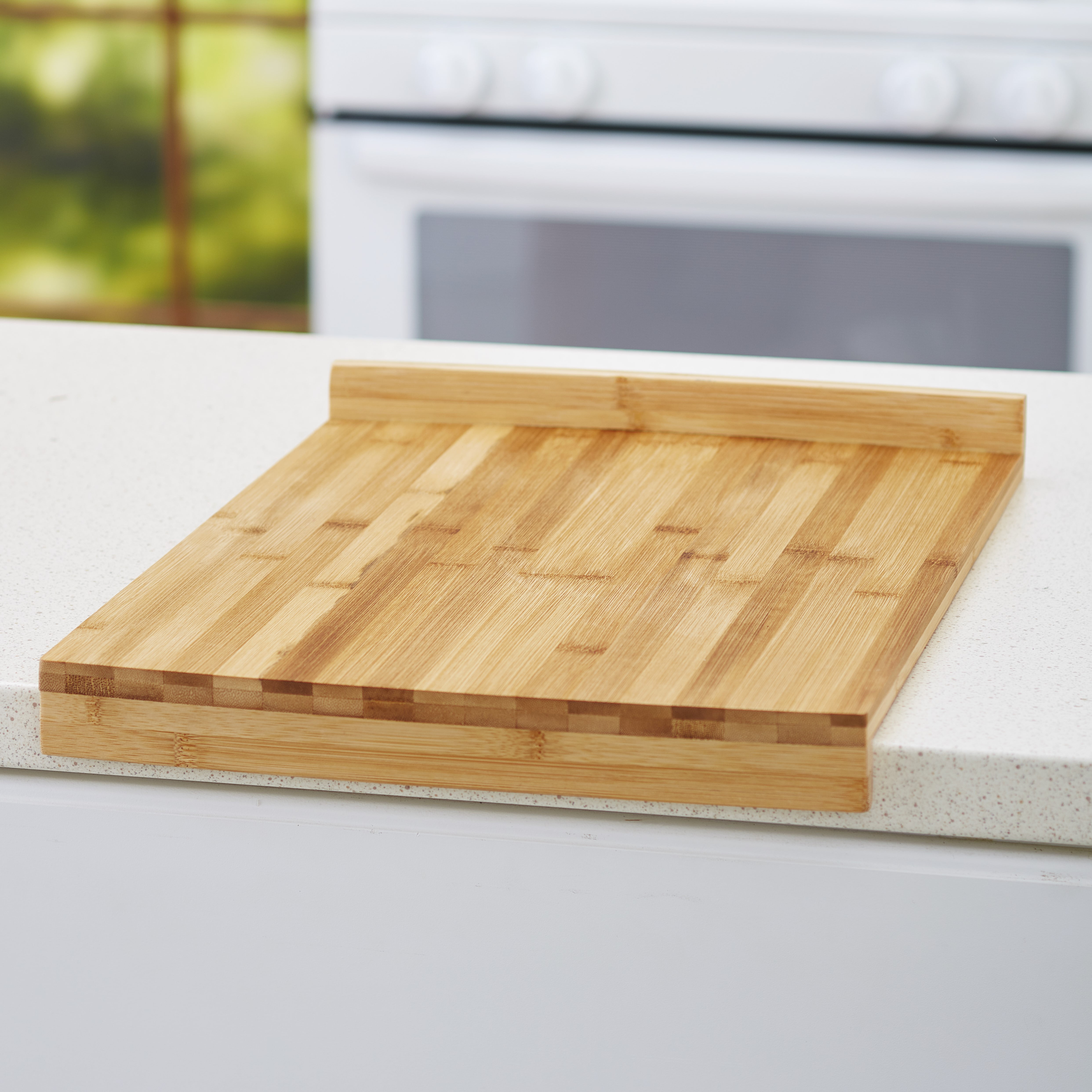 https://i5.walmartimages.com/seo/Stay-Put-Kitchen-Bamboo-Cutting-Board-with-Raised-Edge-Bamboo-Wood_68c004bc-31e1-48bd-893a-4ee445406d36.5d43b17f914d5b0927cfce73aab25715.jpeg