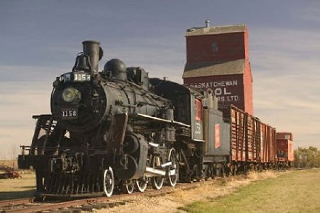 Steam Train and Grain Elevator Canvas Art - Walter Bibikow DanitaDelimont (26 x 17)