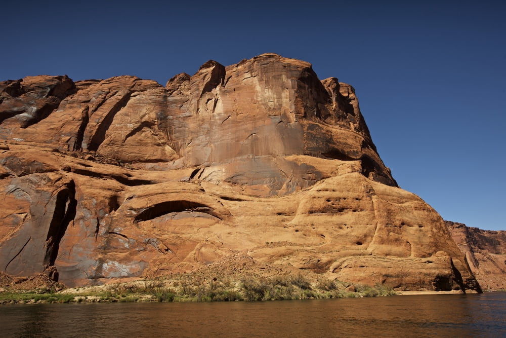 Steep cliffs guard the Colorado River near Lees Ferry Arizona Canvas Art - Terry MooreStocktrek Images (18 x 12)