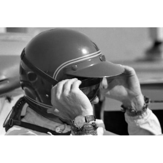 Steve McQueen profile at wheel of race car adjusting goggles with watch 24x36 Poster