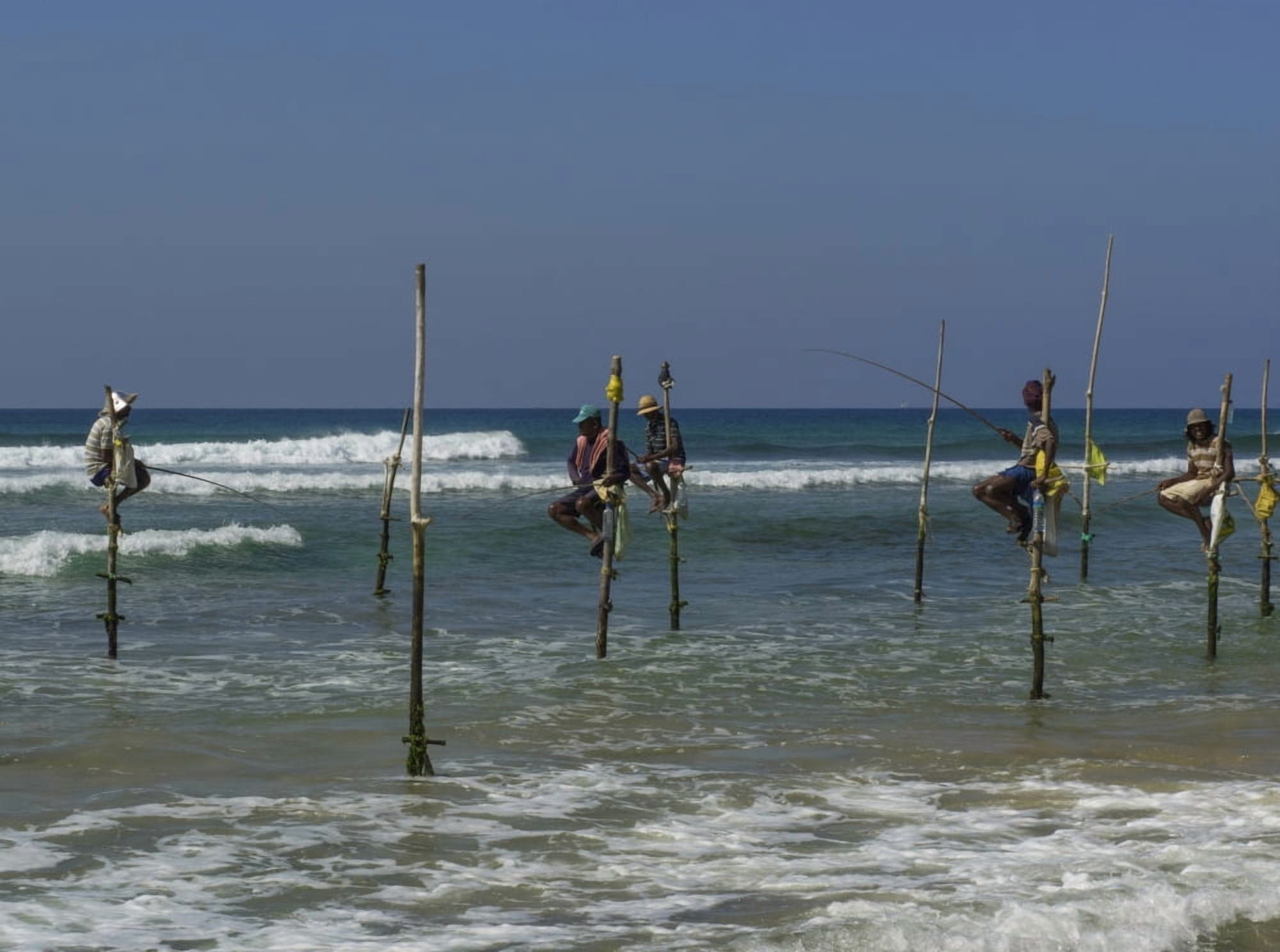 Stilt fishermen on beach Galle Southern Province Sri Lanka Canvas Art - Panoramic Images (36 x 24)