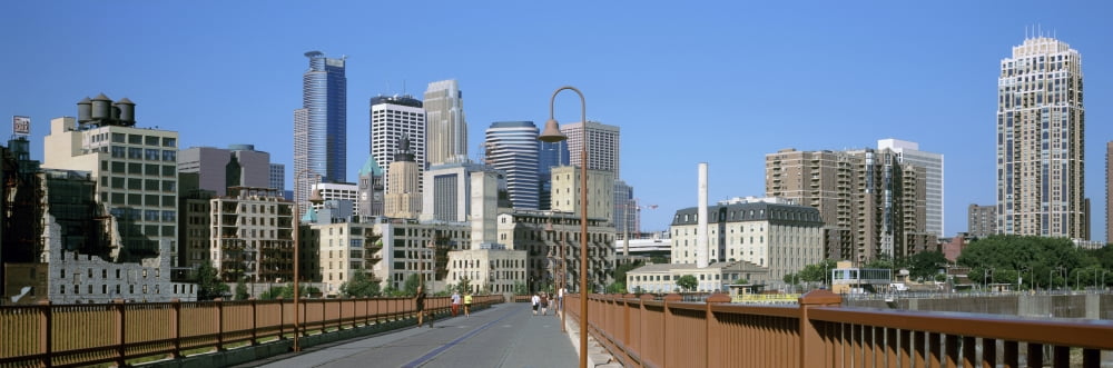 Stone arch bridge with skyscrapers in the background Minneapolis Minnesota USA Canvas Art - Panoramic Images (6 x 18)