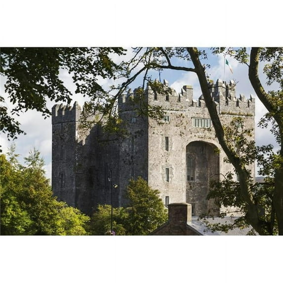 Stone castle framed within trees with clouds and blue sky; Bunratty County Clare Ireland Poster Print