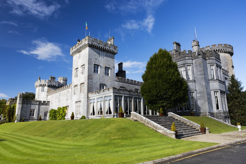 Stone castle on manicured grassy hillside with blue sky and clouds County Clare Ireland Canvas Art - Michael Interisano Design Pics (19 x 12)