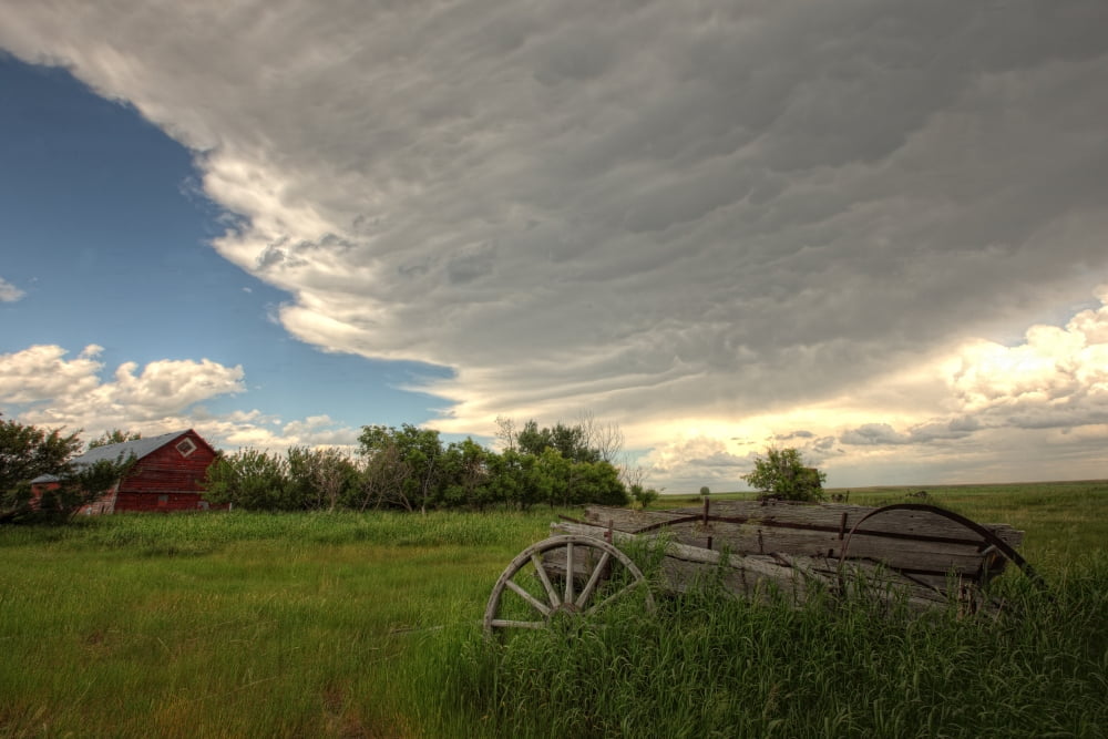 Storm Clouds Gather Over An Abandoned Farm Stead Rural Saskatchewan Canvas Art - Robert Postma Design Pics (17 x 11)