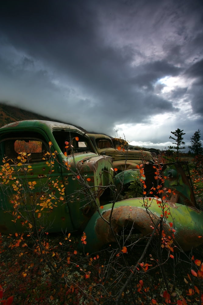 Storm Clouds Over Old Abandoned Trucks North Canol Road Yukon Canvas Art - Robert Postma Design Pics (11 x 17)