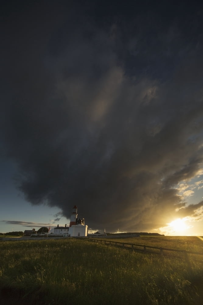 Storm cloud formation over a lighthouse at sunsetSouth shields tyne and wear england Canvas Art - John Short Design Pics (12 x 19)