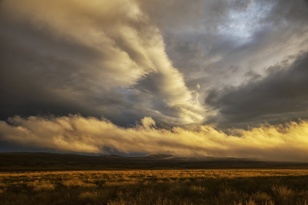 Storm clouds illuminated over the northeastern region of Iceland Iceland Canvas Art - Robert Postma Design Pics (19 x 12)