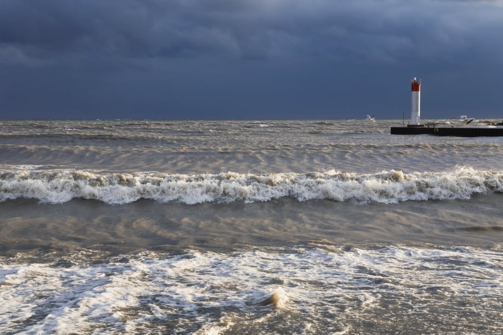 Storm waves crashing on a beach near a lighthouse on lake ontario whitby ontario canada Canvas Art - Mary Ellen McQuay Design Pics (38 x 24)