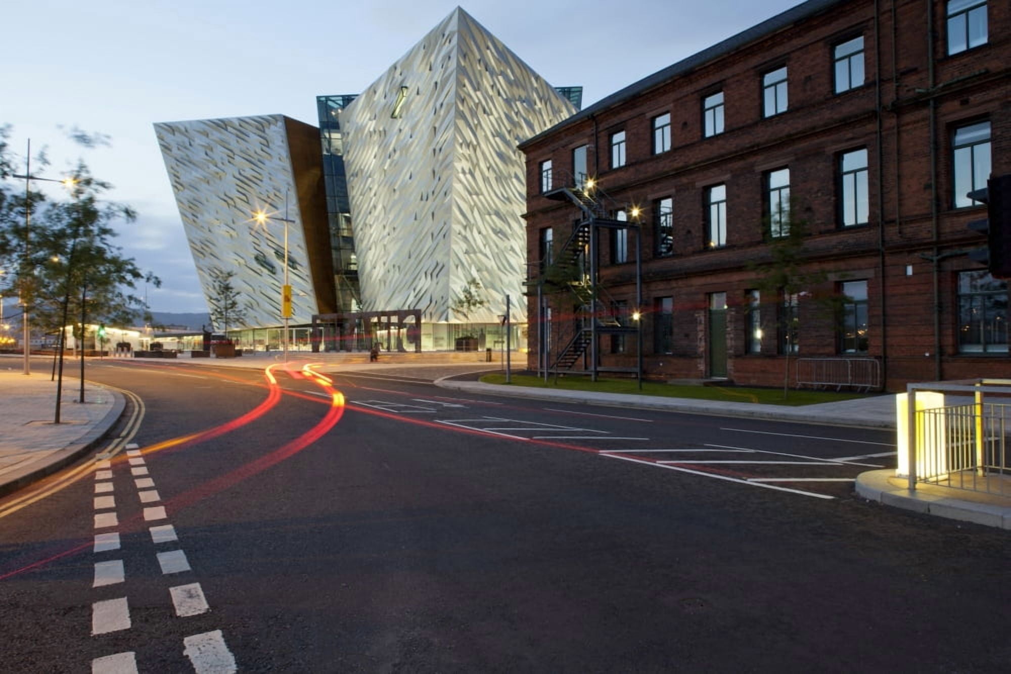 Streak of vehicle tail light on road near Titanic Quarter Building Belfast County Antrim Northern Ireland Canvas Art - Panoramic Images (36 x 12)