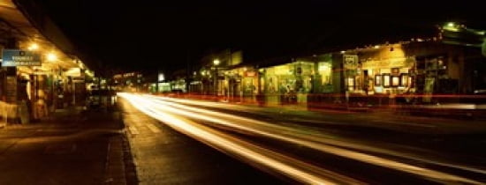 Streaks of lights on the road in a city at night Lahaina Maui Hawaii USA Canvas Art - Panoramic Images (30 x 12)