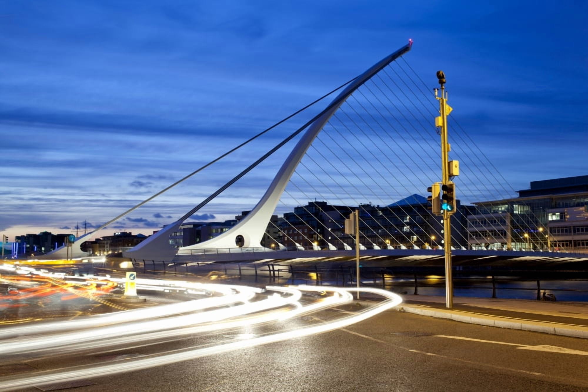 Streaks of vehicle headlights on road with Samuel Beckett Bridge at dusk Liffey River Dublin Leinster Province Republic of Ireland Canvas Art - Panoramic Images (36 x 12)