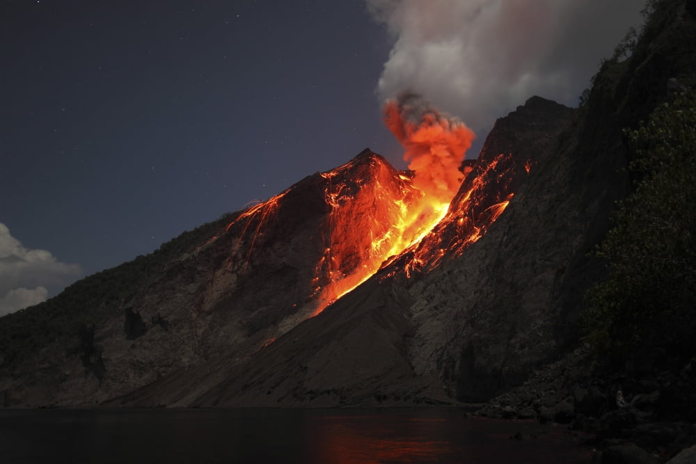 Strombolian type eruption of Batu Tara volcano Indonesia Canvas Art - Richard RoscoeStocktrek Images (18 x 12)