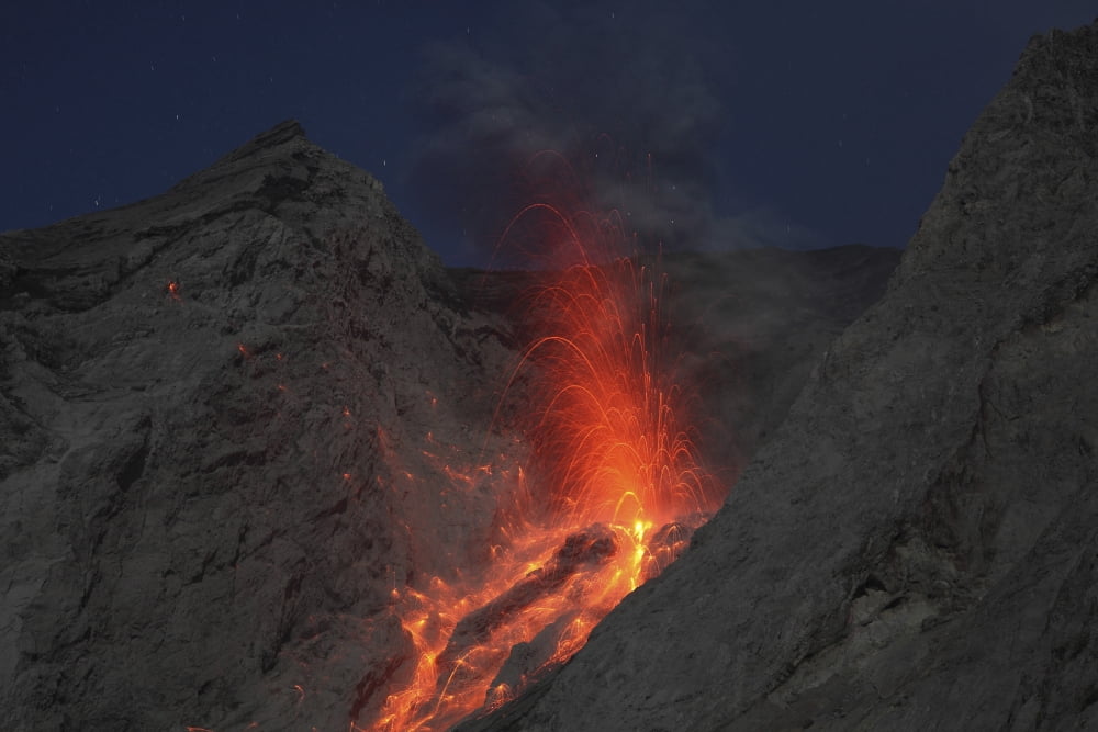 Strombolian type eruption of Batu Tara volcano Indonesia Canvas Art - Richard RoscoeStocktrek Images (35 x 23)