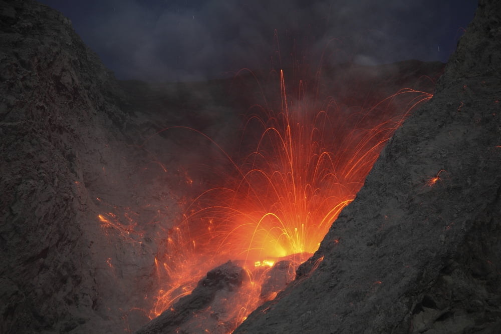 Strombolian type eruption of Batu Tara volcano Indonesia Canvas Art - Richard RoscoeStocktrek Images (35 x 23)