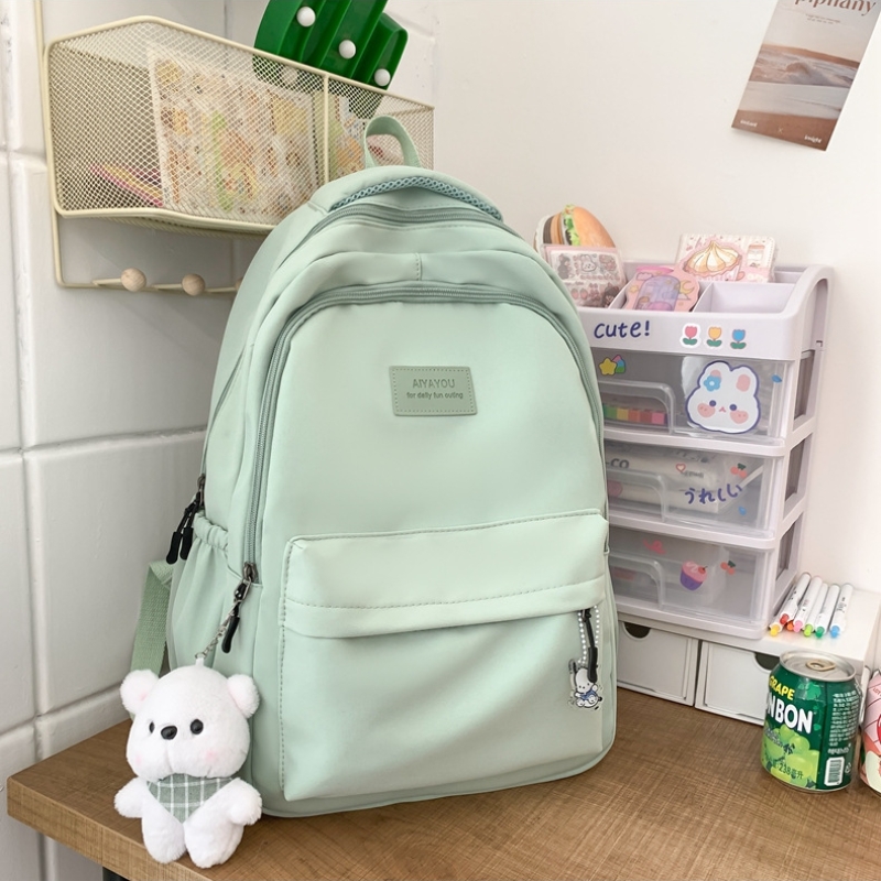 Student Japanese large-capacity backpack Teenagers simple and versatile backpack Unisex polyester material Doll decoration