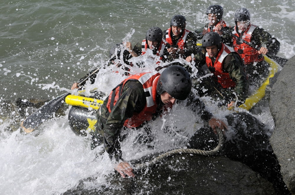 Students in Basic Underwater DemolitionSEAL participate in rock portage in Coronado California Canvas Art - Stocktrek Images (35 x 23)