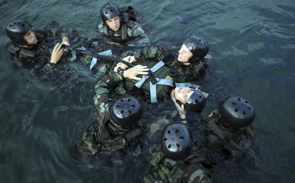 Students secure a simulated casualty to a spine board during a training scenario Canvas Art - Stocktrek Images (36 x 22)
