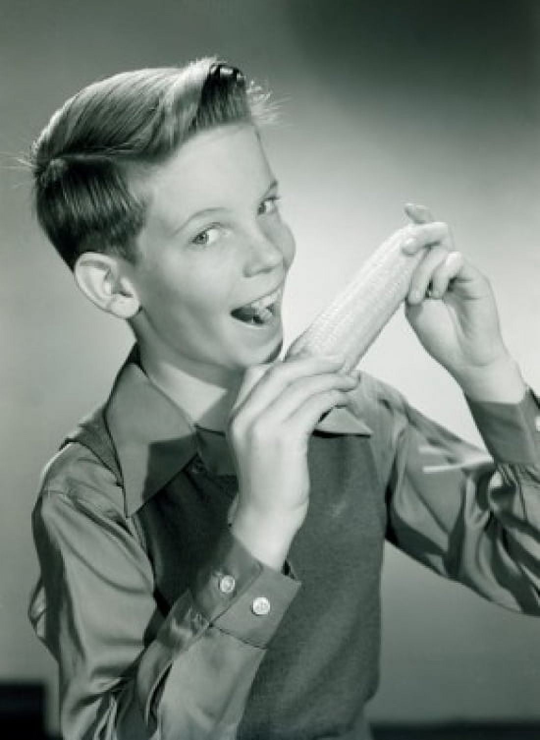 Studio portrait of boy eating corn on the cob Canvas Art -  (24 x 36)