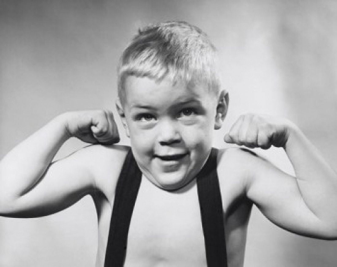 Studio portrait of boy flexing muscles Canvas Art - (18 x 24)