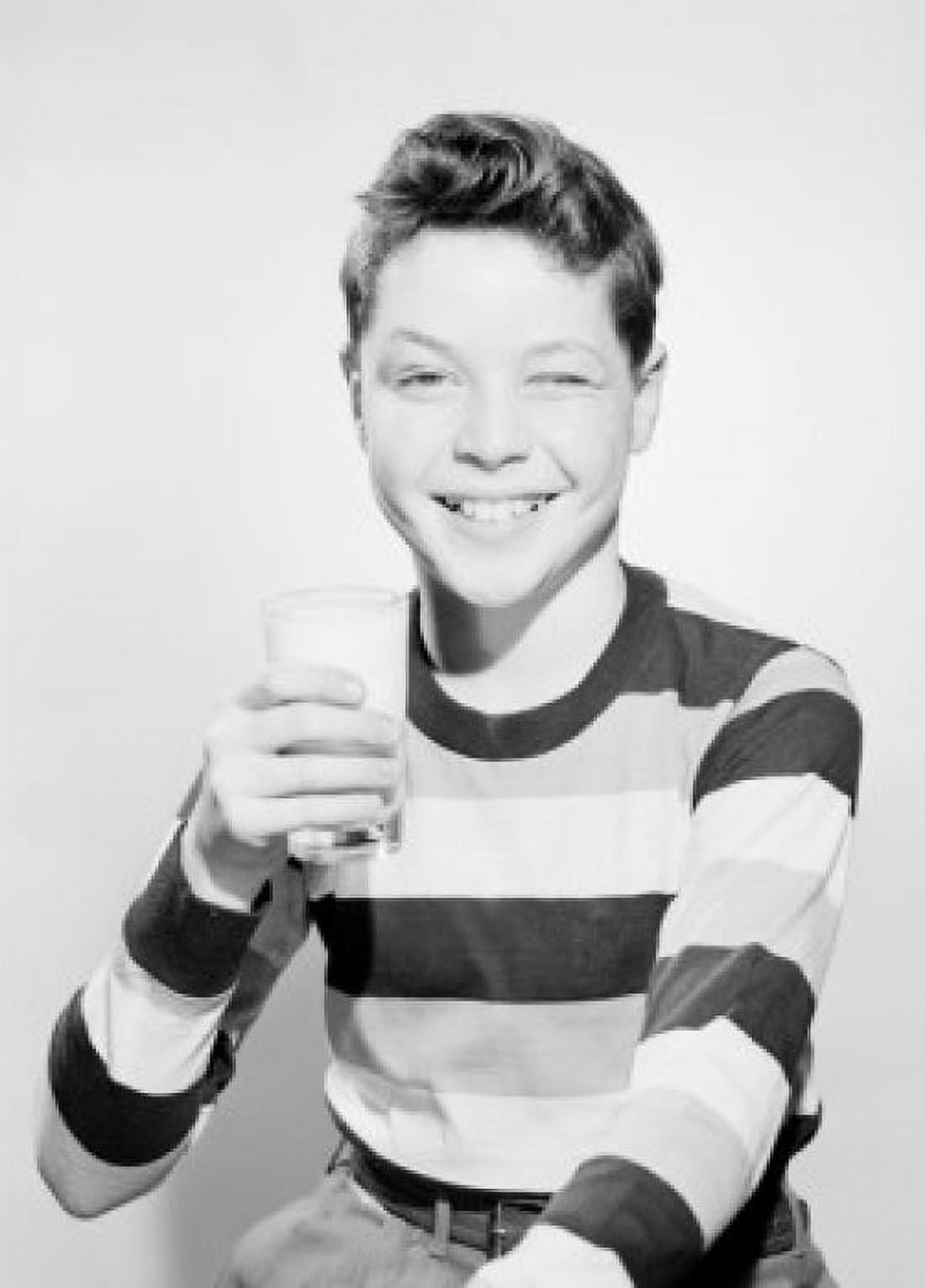 Studio portrait of boy holding glass of milk Canvas Art - (24 x 36)