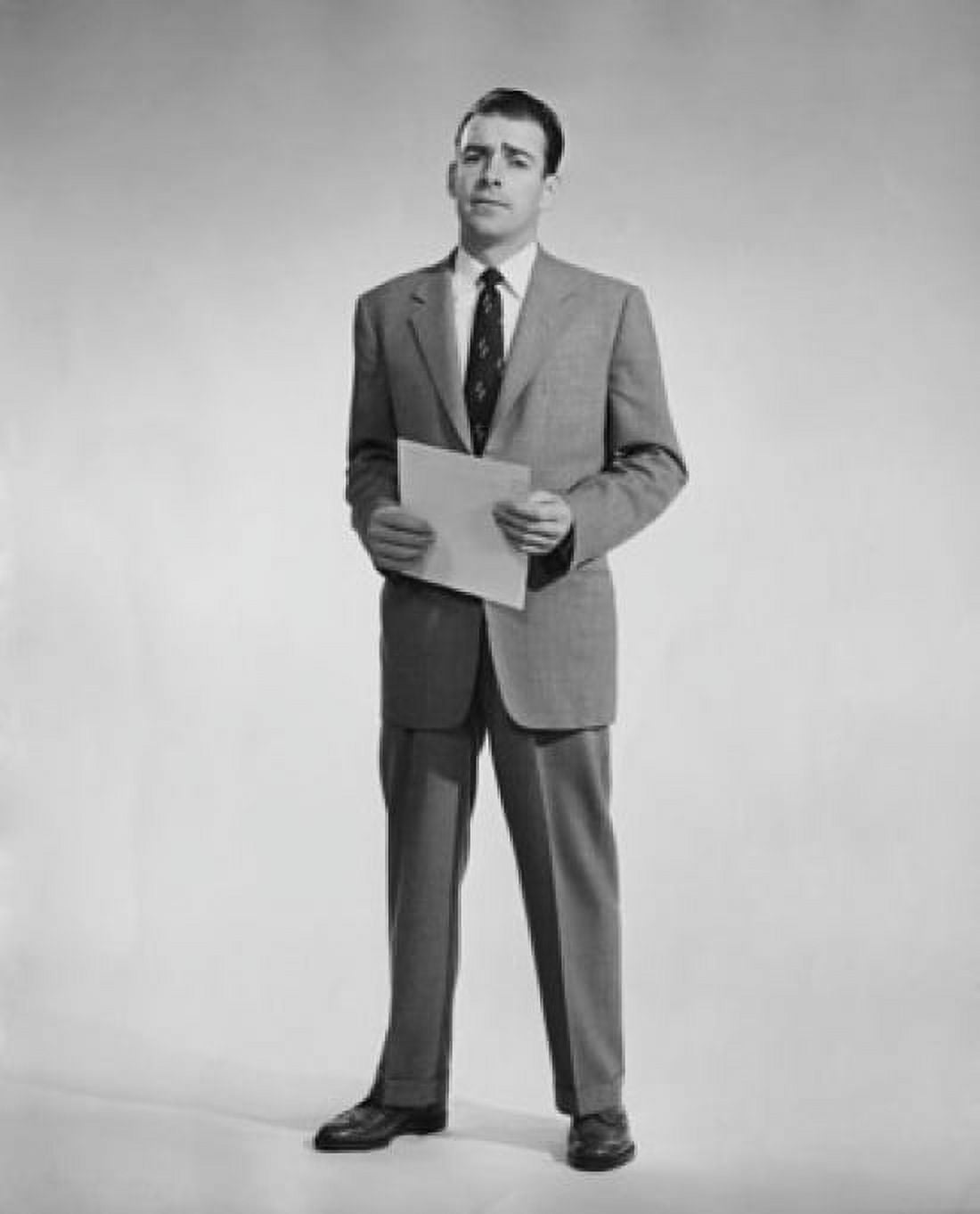 Studio portrait of businessman holding document Canvas Art - (24 x 36)